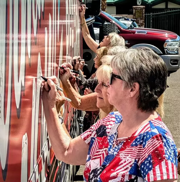 Americans for Pharma Reform Women Signing the Bus